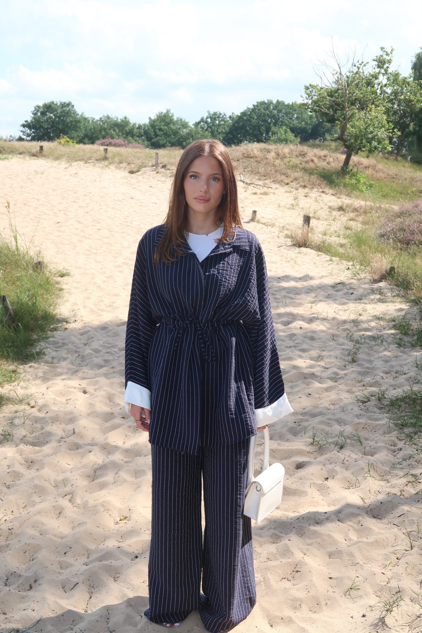 Two-piece suit in dark blue with pinstripes
