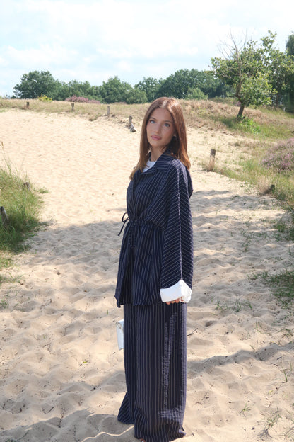 Two-piece suit in dark blue with pinstripes