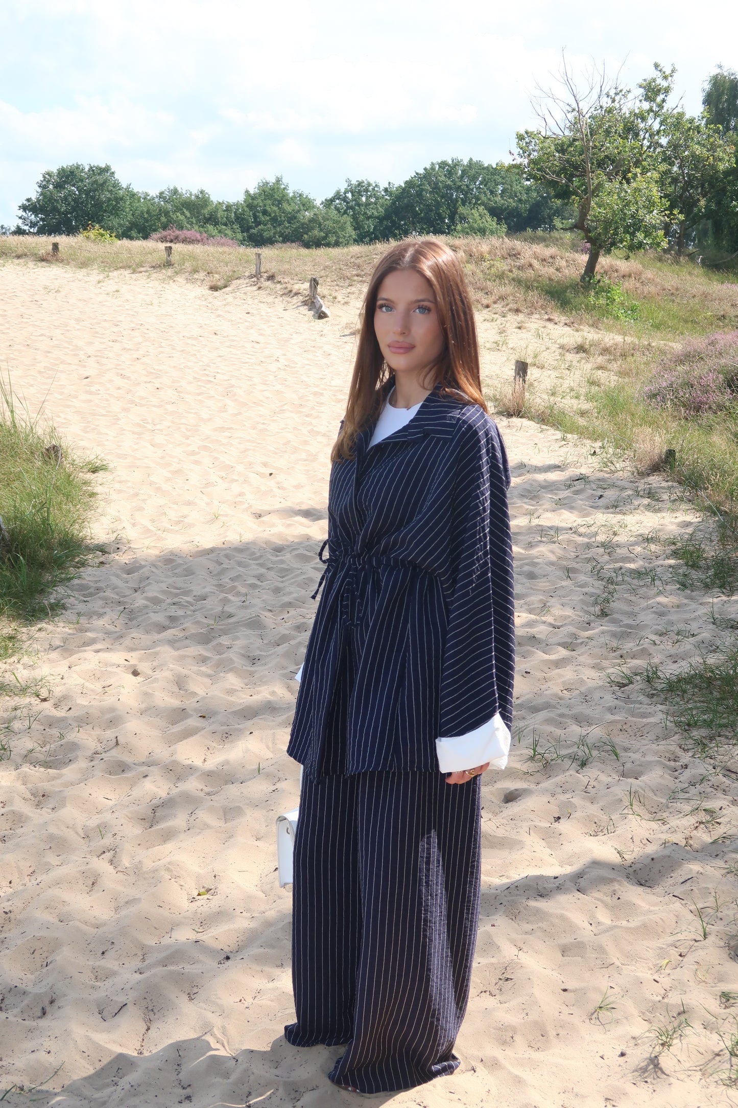 Two-piece suit in dark blue with pinstripes
