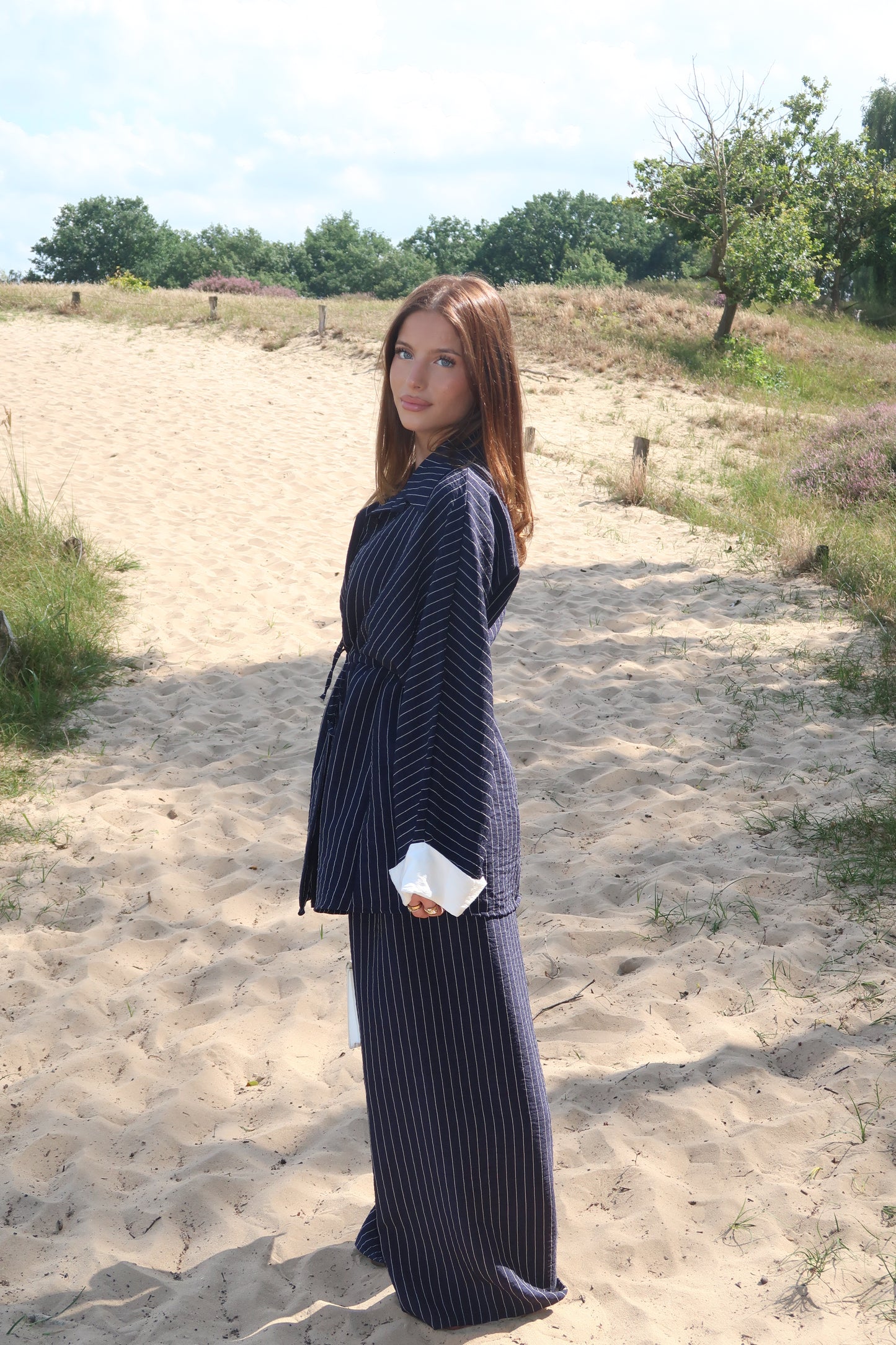 Two-piece suit in dark blue with pinstripes