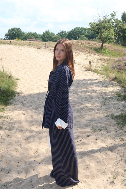 Two-piece suit in dark blue with pinstripes
