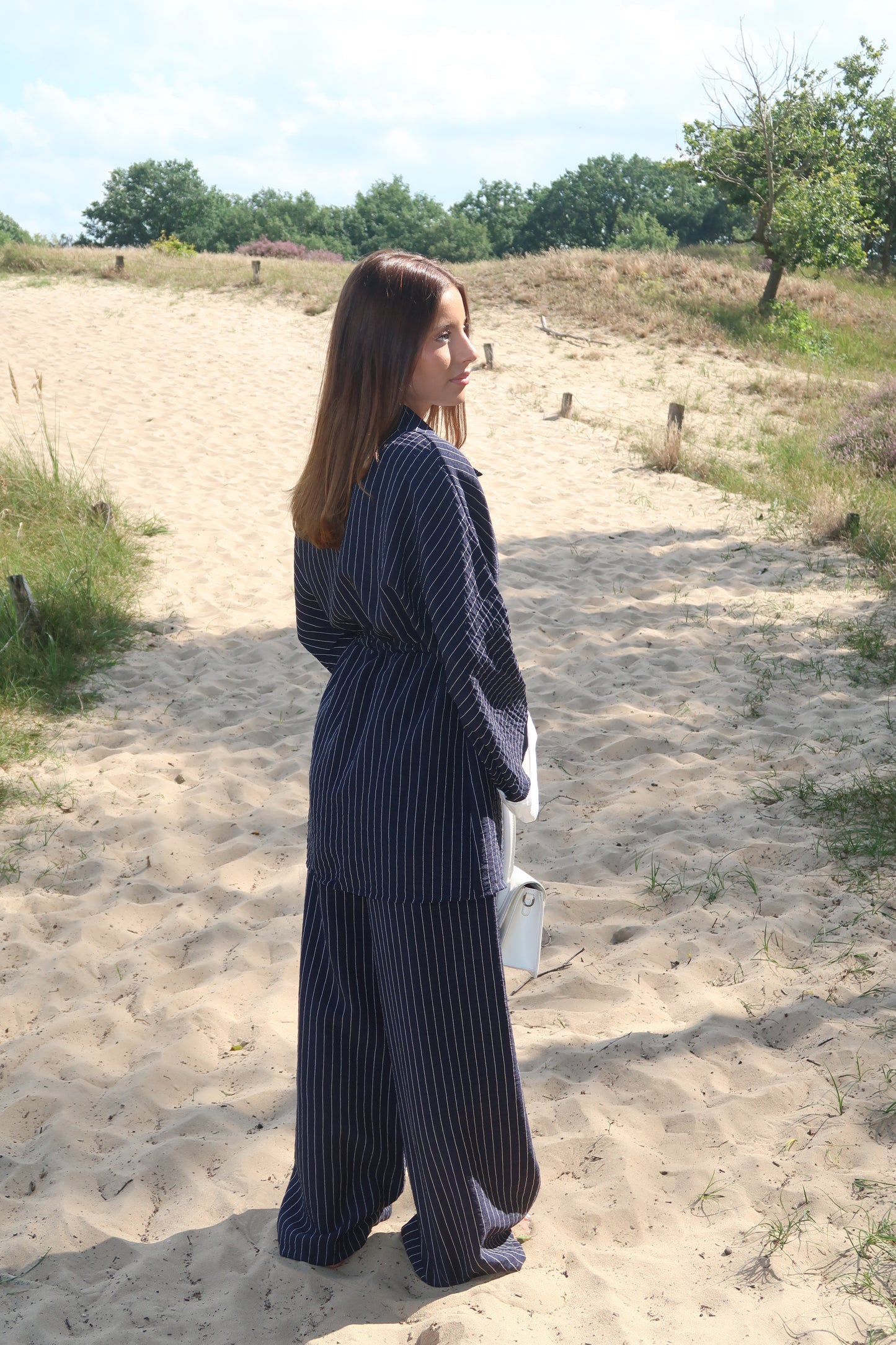 Two-piece suit in dark blue with pinstripes