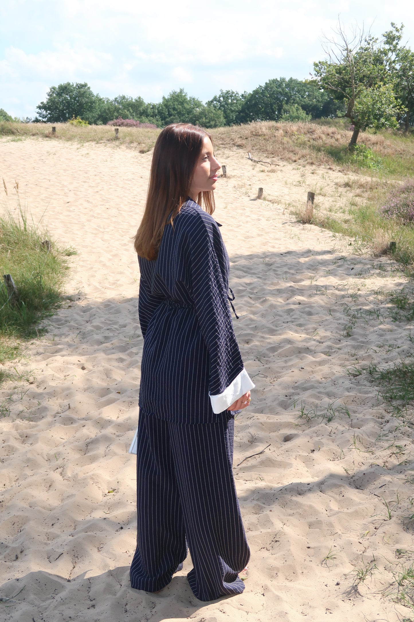 Two-piece suit in dark blue with pinstripes